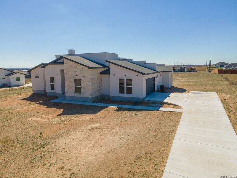 Exterior details and patio area of a home in , La Vernia (Image 23).