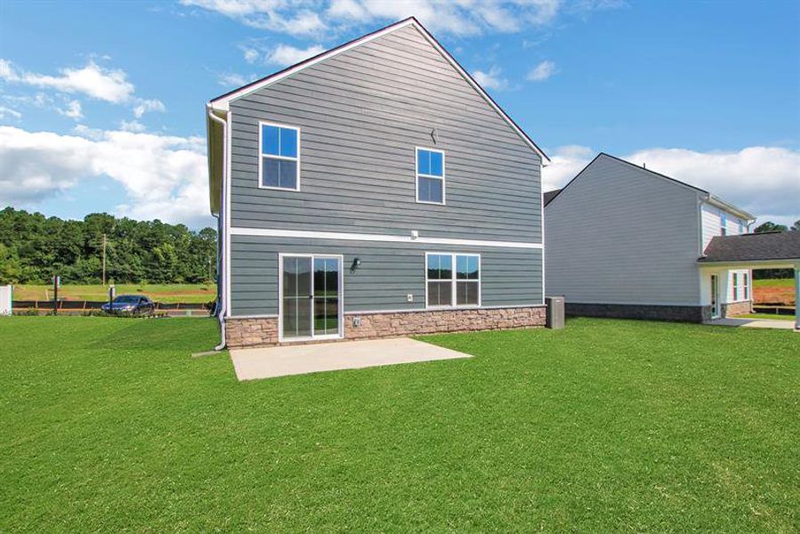 Exterior details and patio area of a home in Aspen Meadows, Hampton (Image 2).