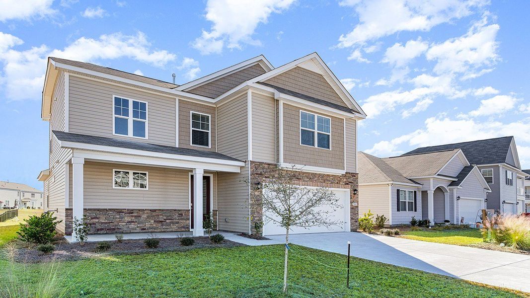 Representative exterior photo of a completed home built from the Belfort by D.R. Horton in Heron Pointe, Myrtle Beach, SC (Image 19).