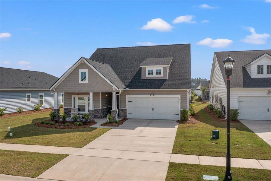Front exterior of a new home in Horizons at Summers Corner | 55+, Summerville, SC, highlighting curb appeal (Image 2).