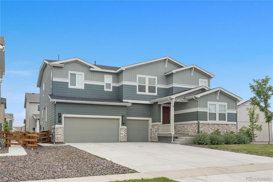 Front exterior of a new home in Morgan Hill, Erie, CO, highlighting curb appeal (Image 21).