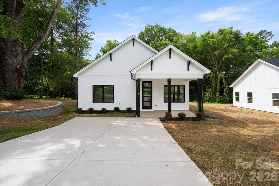 Front exterior of a new home in , Stanley, NC, highlighting curb appeal (Image 1). Front exterior of a new home in , Stanley, NC, highlighting curb appeal (Image 1).