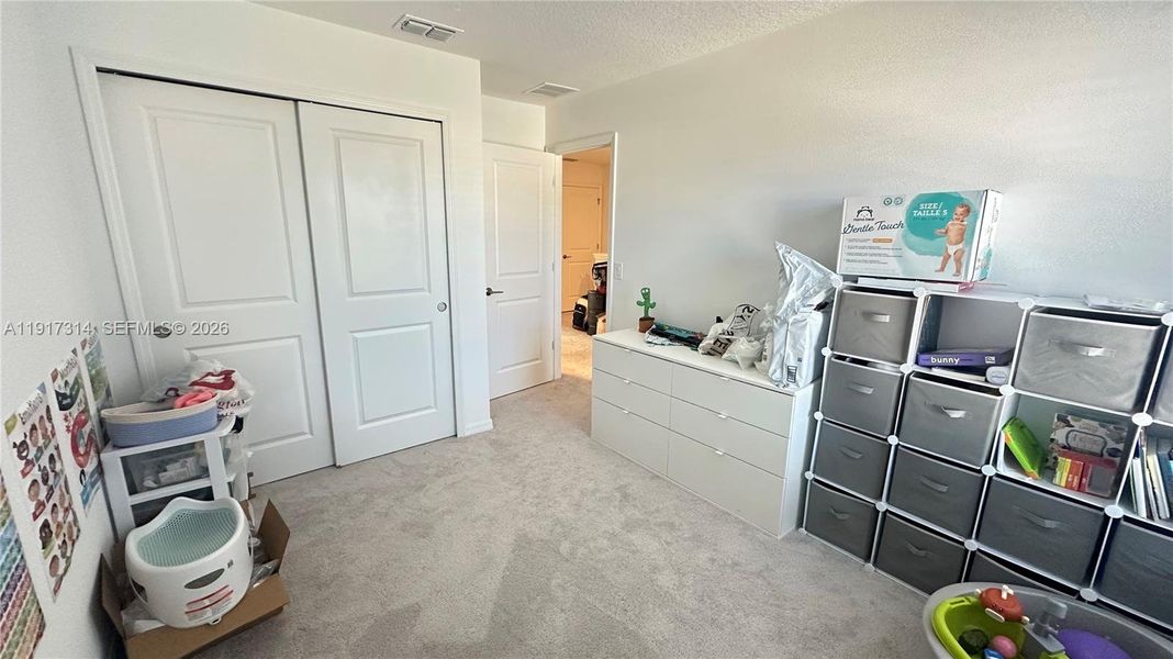 Furnished interior view inside a new home in The Townhomes at Bellalago, Kissimmee (Image 16).