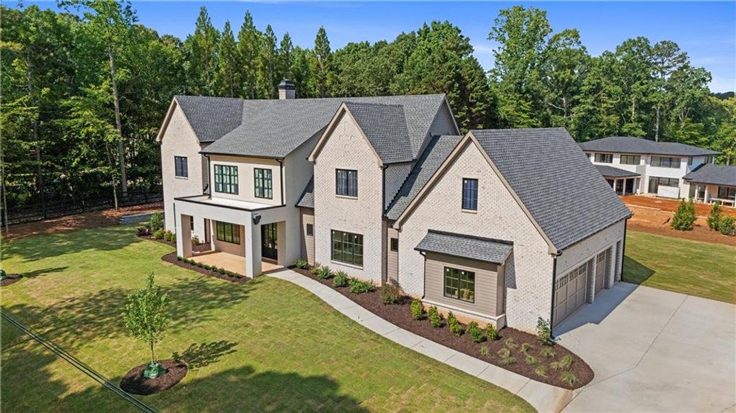 Front exterior of a new home in , Suwanee, GA, highlighting curb appeal (Image 26). Front exterior of a new home in , Suwanee, GA, highlighting curb appeal (Image 26).