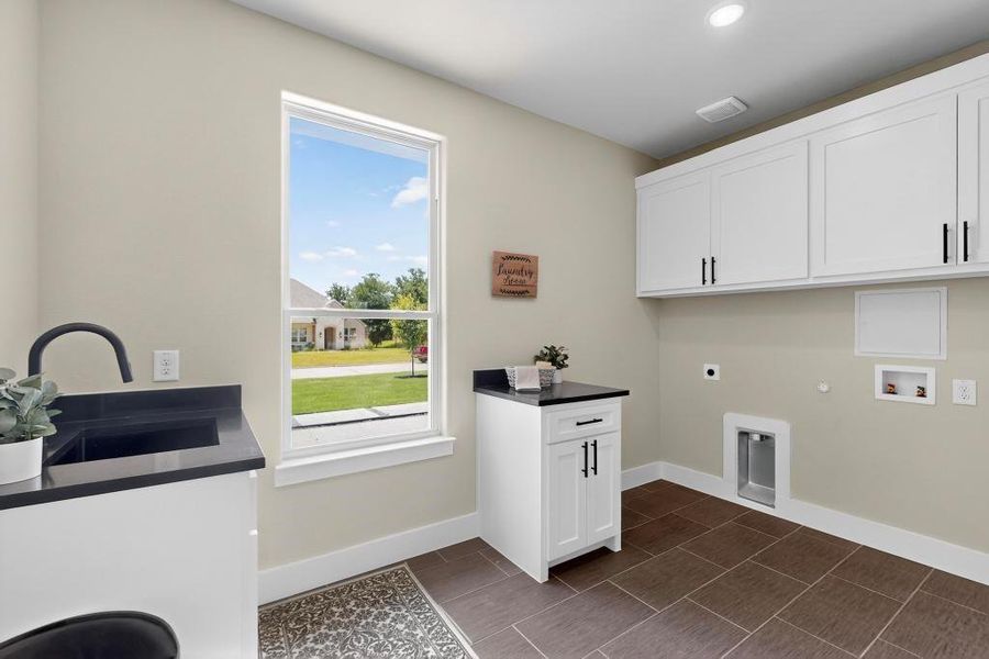 Washroom featuring cabinet space, hookup for an electric dryer, hookup for a gas dryer, washer hookup, and recessed lighting