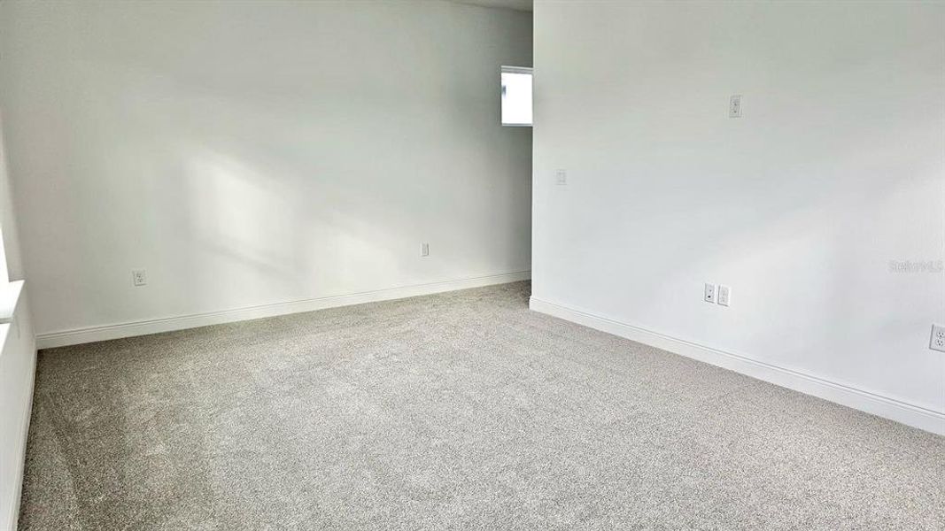 Spacious, unfurnished interior of a new home in Laureate Park, Orlando (Image 32).