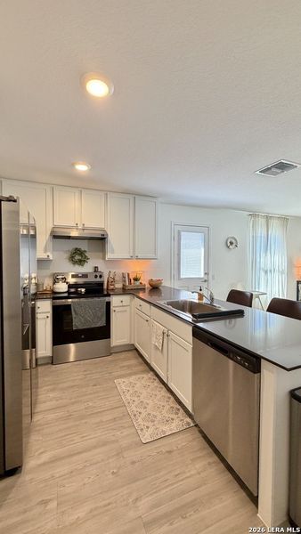Furnished interior view inside a new home in Mission del Lago, San Antonio (Image 11).