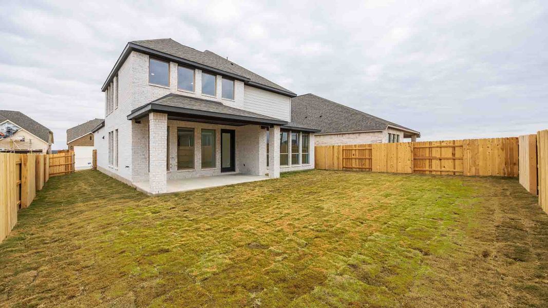 Exterior details and patio area of a home in Lariat 45', Liberty Hill (Image 2). Exterior details and patio area of a home in Lariat 45', Liberty Hill (Image 2).