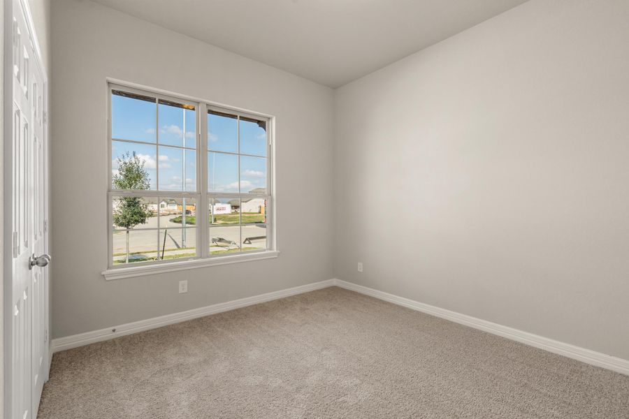 Secondary Bedroom. Note: Sample product photo - actual exterior and interior selections may vary by homesite