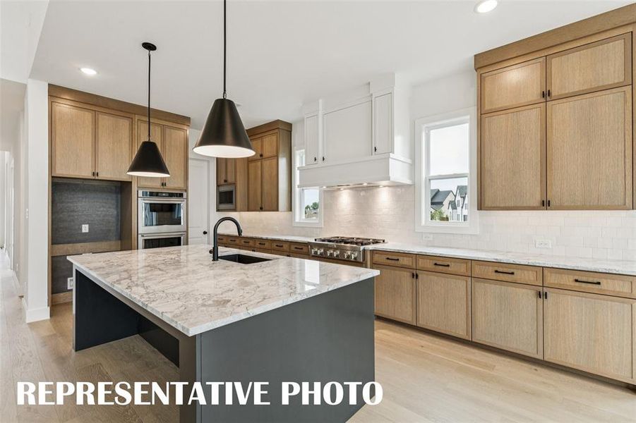 Featuring tons of storage and fantastic finishes, the kitchen of your dreams awaits! REPRESENTATIVE PHOTO.