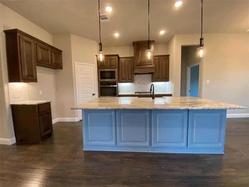 Elegant kitchen has so much cabinet storage space and is perfect for entertaining.