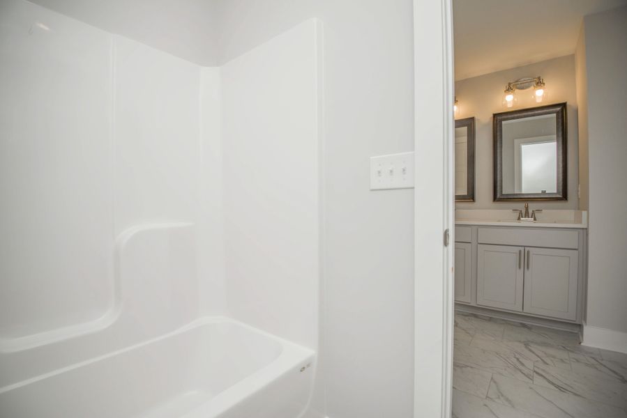 *Photo of example home. Selections and Finishes May Vary.* *Photo of example home. Selections and Finishes May Vary.*