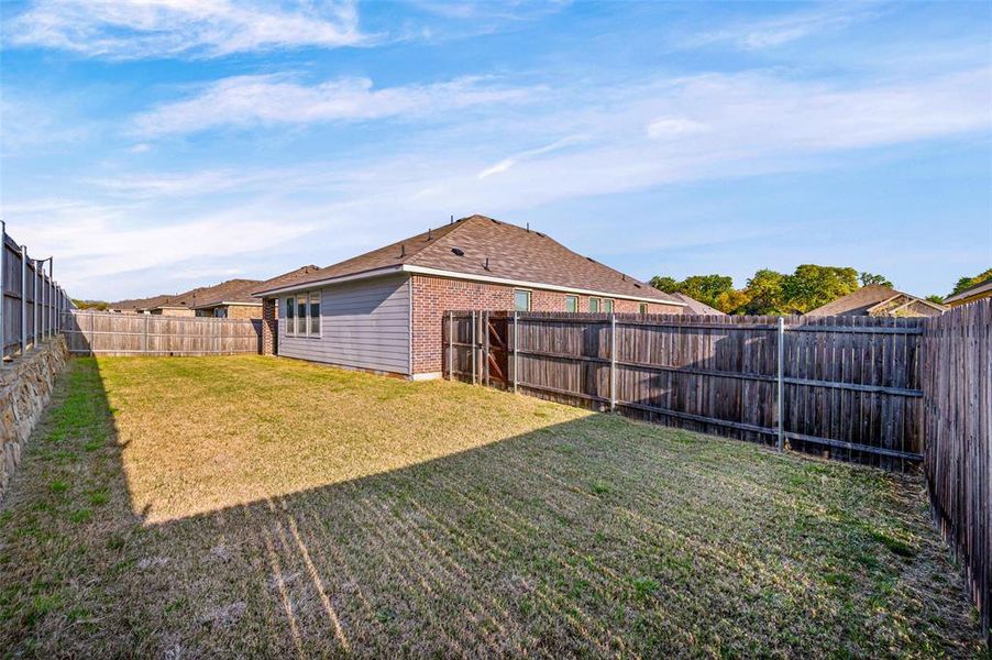 Exterior details and patio area of a home in Azle Grove, Azle (Image 28).