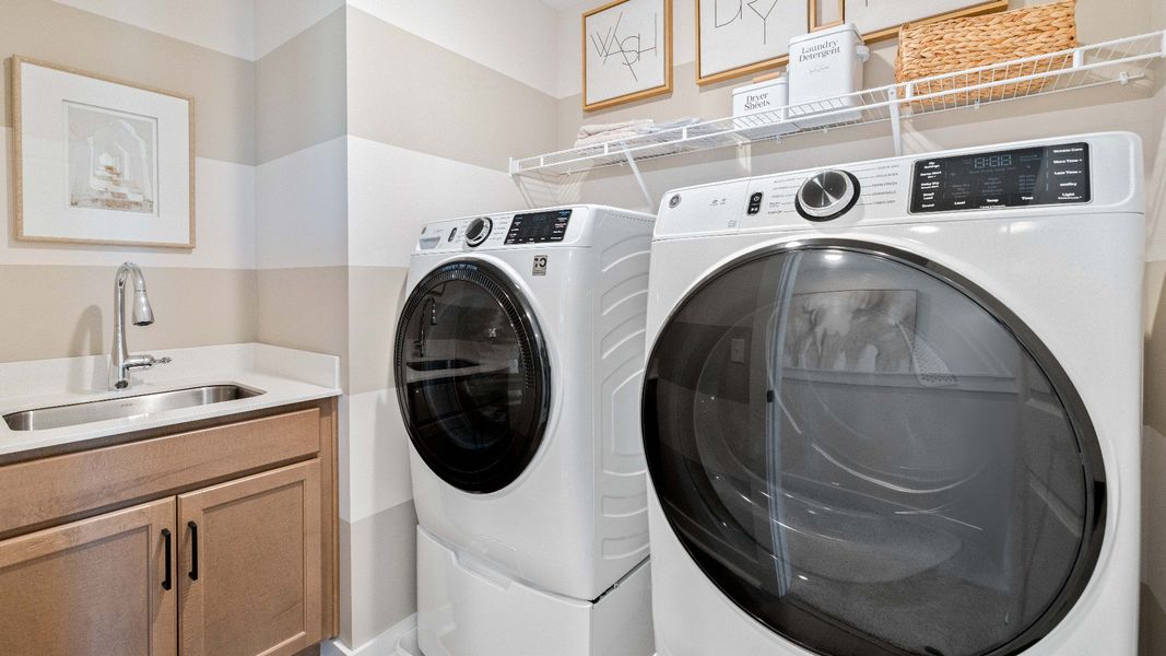 Laundry room with sink and ventilated shelf