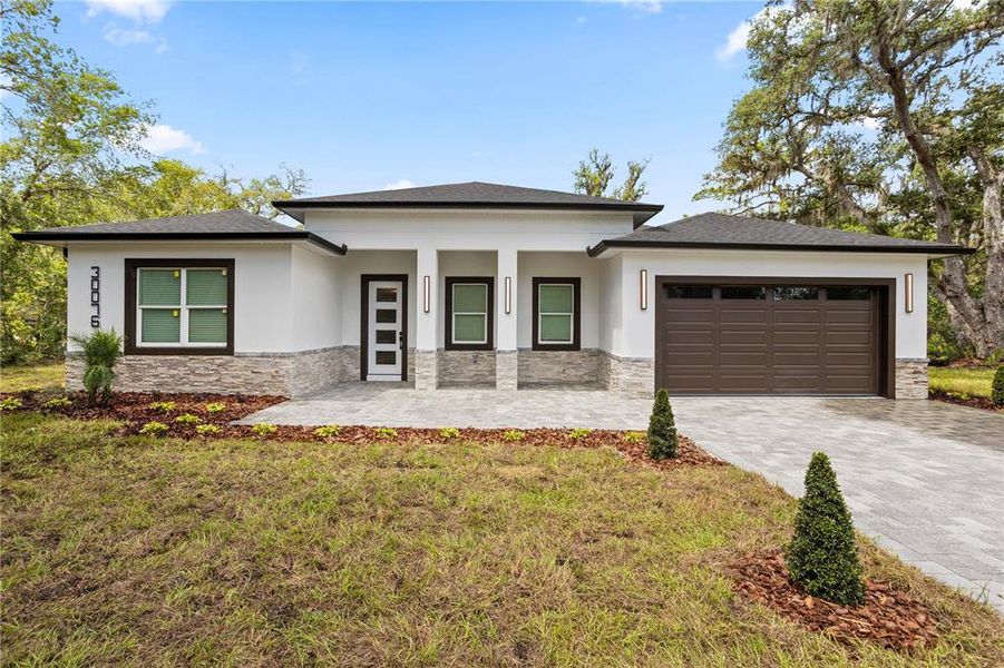 Front exterior of a new home in , Eustis, FL, highlighting curb appeal (Image 25).