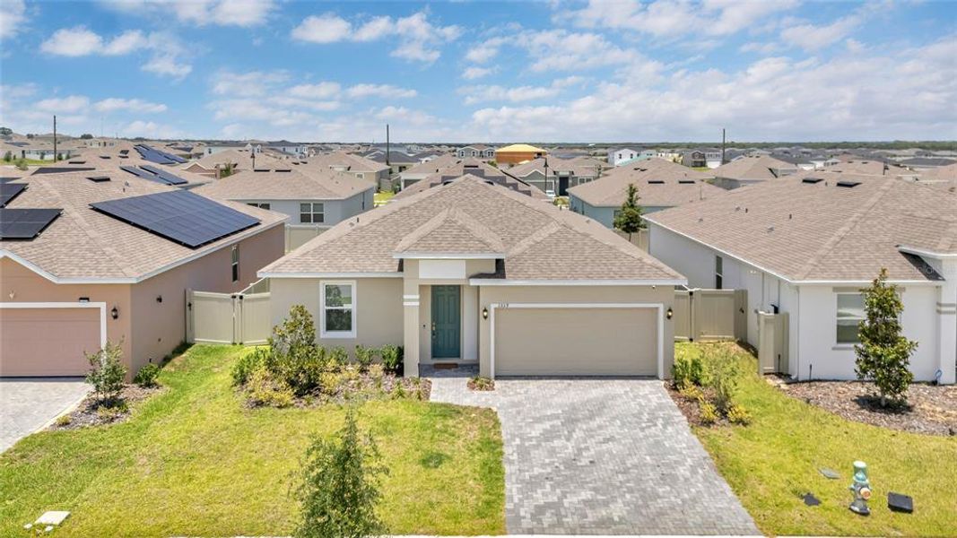 Front exterior of a new home in Tarpon Bay, Haines City, FL, highlighting curb appeal (Image 21). Front exterior of a new home in Tarpon Bay, Haines City, FL, highlighting curb appeal (Image 21).