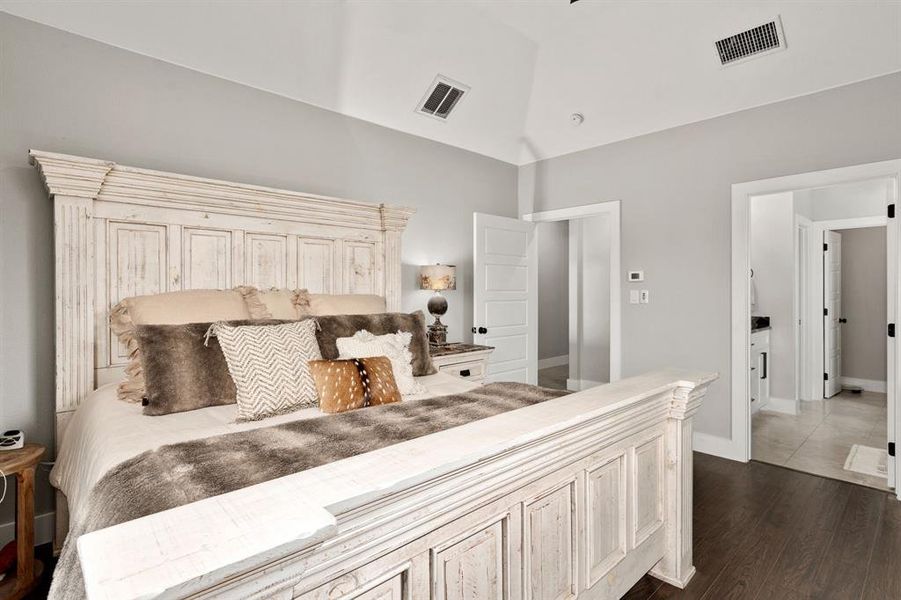 Primary Bedroom with vaulted ceiling and en-suite bathroom.