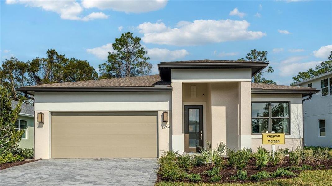Front exterior of a new home in Cresswind DeLand, Deland, FL, highlighting curb appeal (Image 1). Front exterior of a new home in Cresswind DeLand, Deland, FL, highlighting curb appeal (Image 1).