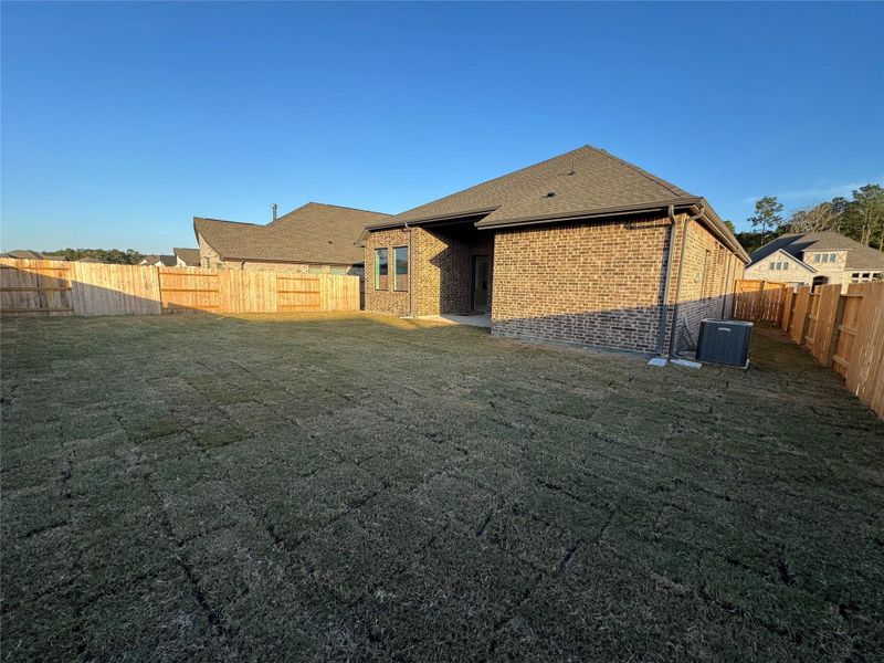 Exterior details and patio area of a home in The Trails, New Caney (Image 26).