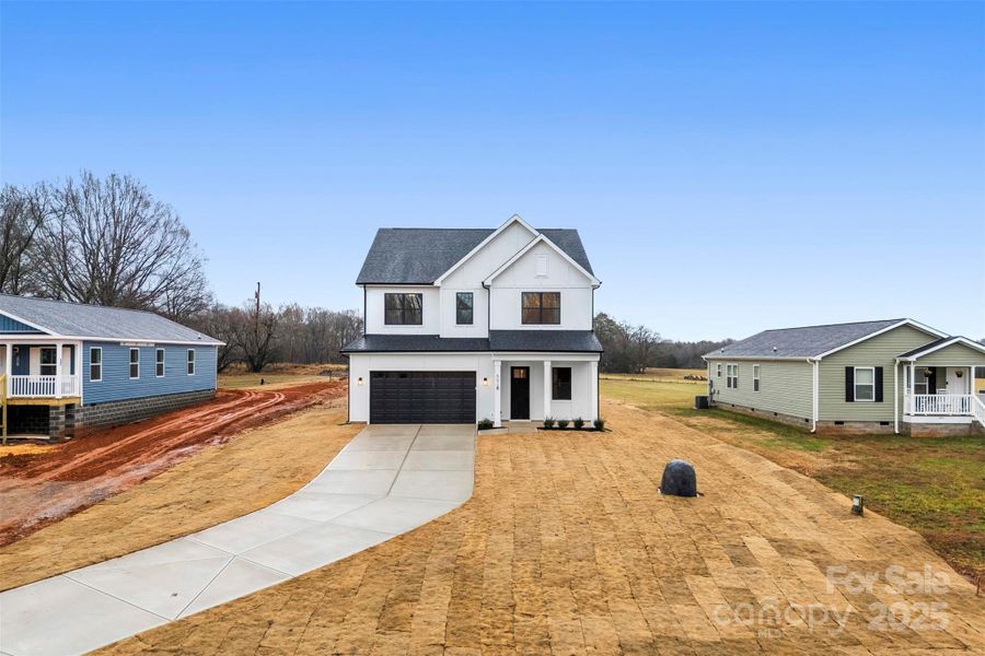 Front exterior of a new home in , Troutman, NC, highlighting curb appeal (Image 27). Front exterior of a new home in , Troutman, NC, highlighting curb appeal (Image 27).