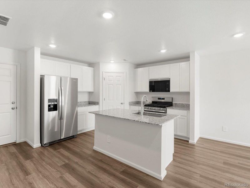 Furnished interior view inside a new home in Skyview at High Point, Aurora (Image 9).