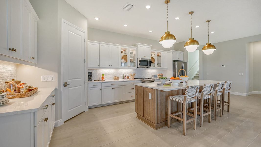 Furnished interior view inside a new home in SkySail Real Estate and Homes for Sale in Naples, FL - Neal Communities, Naples (Image 10).