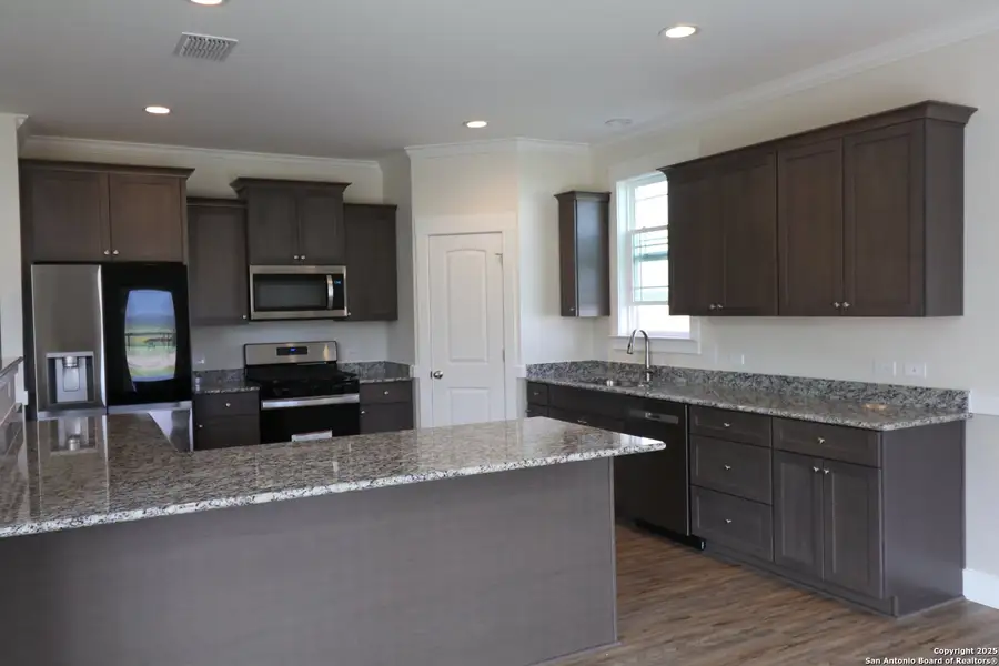 Furnished interior in a model home at Lonesome Dove in San Antonio (Image 4).