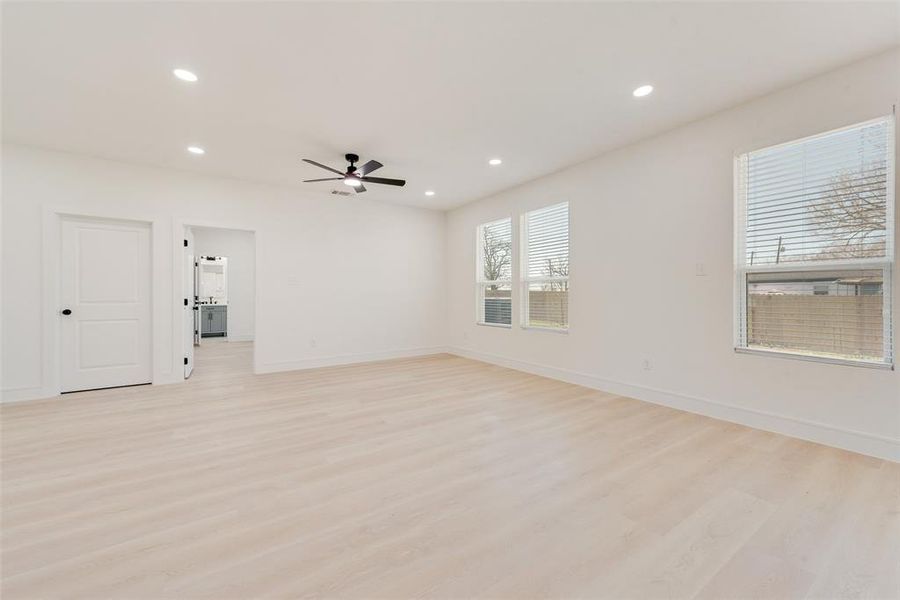 Spare room featuring ceiling fan and light hardwood / wood-style flooring