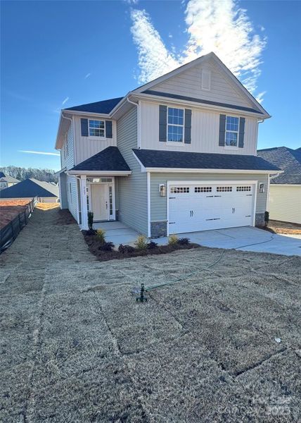 Front exterior of a new home in Village at Parkside, Gastonia, NC, highlighting curb appeal (Image 12).