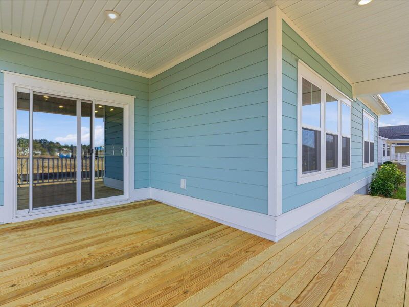 Exterior details and patio area of a home in The Coves at Lakes of Cane Bay, Summerville (Image 28).