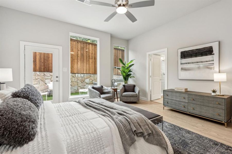 Bedroom with ceiling fan and light wood-type flooring