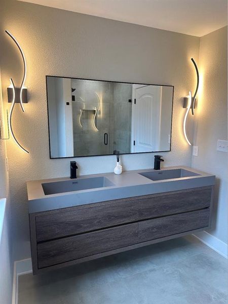 Bathroom with vanity and walk in shower