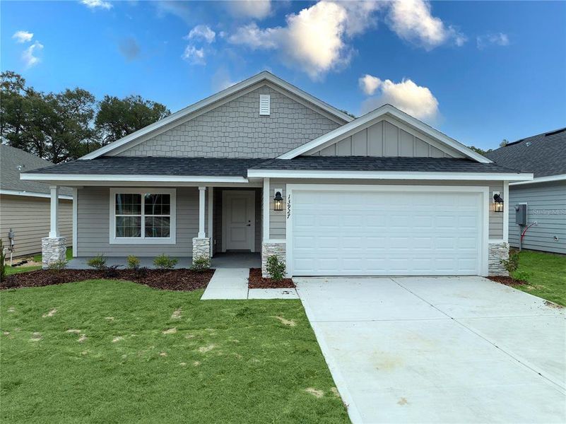 Front exterior of a new home in Briarwood, Alachua, FL, highlighting curb appeal (Image 26).