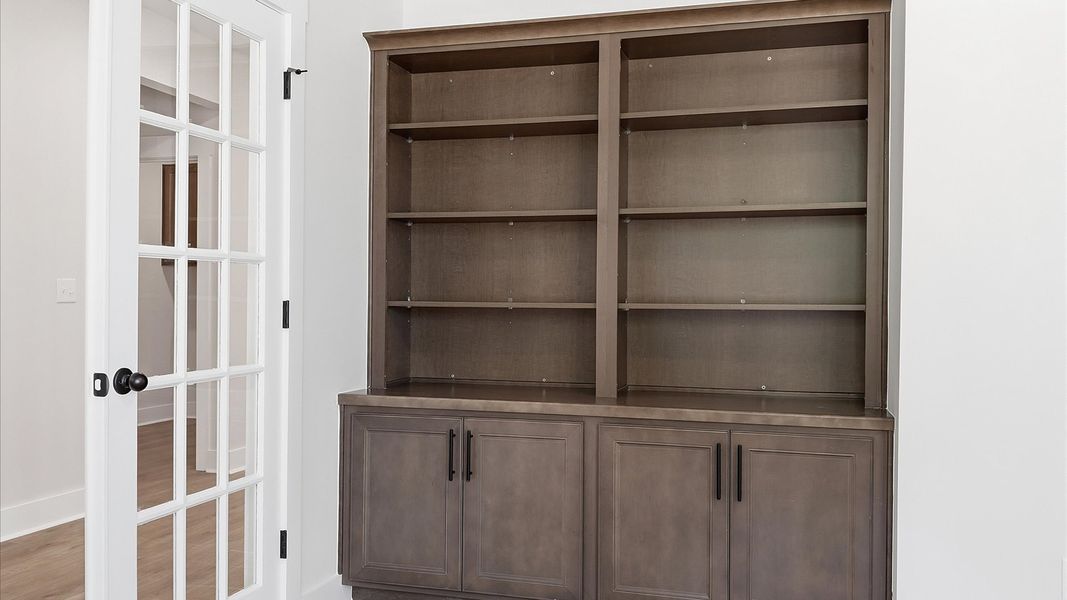 Refined and quiet study behind French doors—perfect for focused work or peaceful retreat at the Pinebrook community