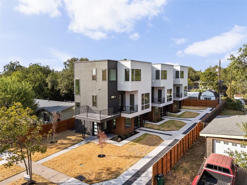 Crisp architectural lines define the exterior of these modern multi-level townhomes.