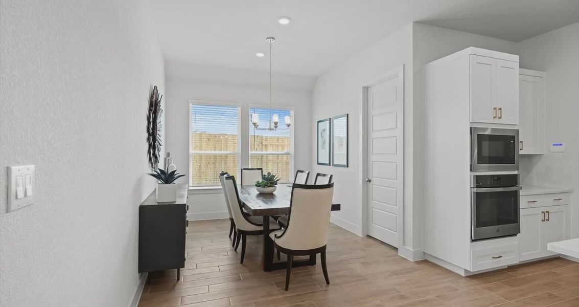 Representative furnished interior of a home built from the Maddie by Chesmar Homes in Buffalo Crossing, Cibolo (Image 7).