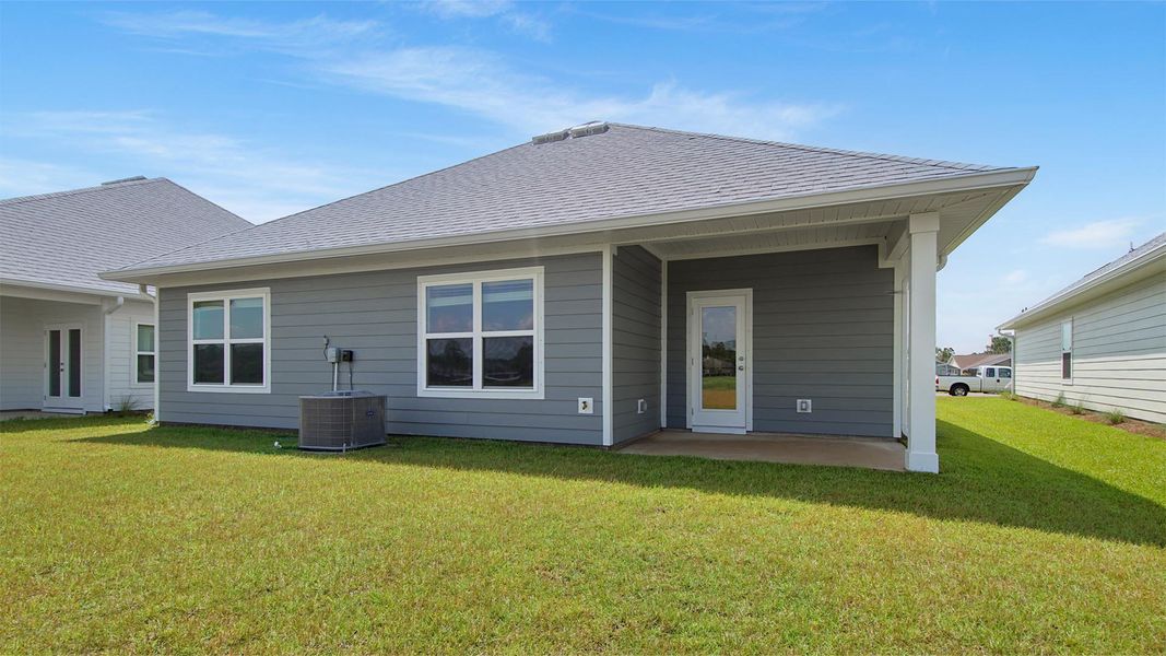 Exterior details and patio area of a home in Caballeros Estates At Hombre, Panama City Beach (Image 2).