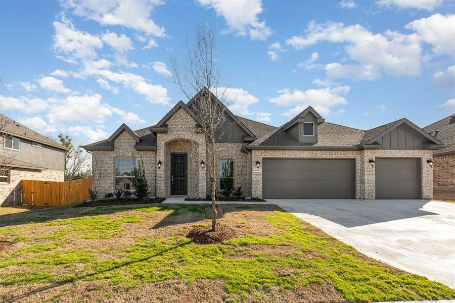 Front exterior of a new home in Cole Crossing Estates, DeSoto, TX, highlighting curb appeal (Image 18).