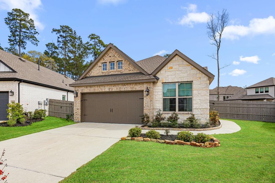 Front exterior of a new home in Artavia: Avante Collection, Conroe, TX, highlighting curb appeal (Image 23).