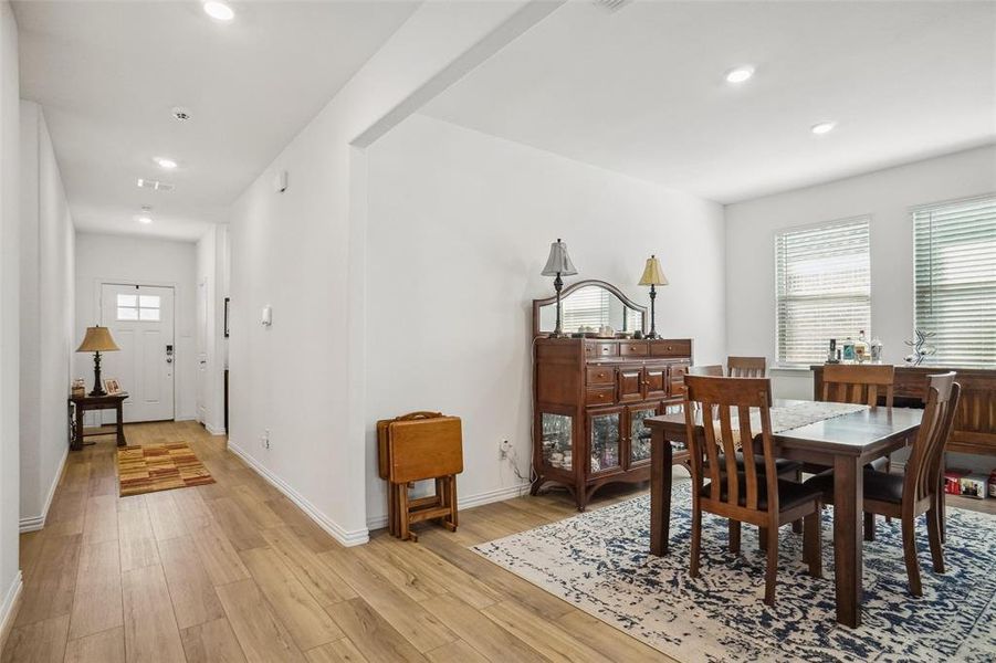 Dining space with a wealth of natural light and light hardwood / wood-style floors