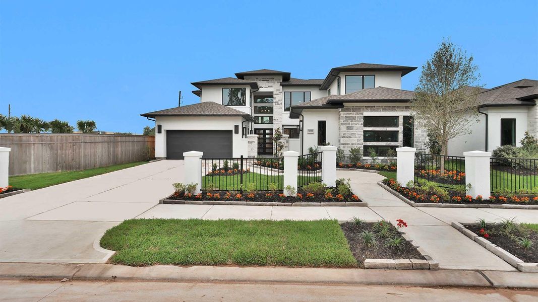 Front exterior of a new home in Sienna, Missouri City, TX, highlighting curb appeal (Image 1). Front exterior of a new home in Sienna, Missouri City, TX, highlighting curb appeal (Image 1).