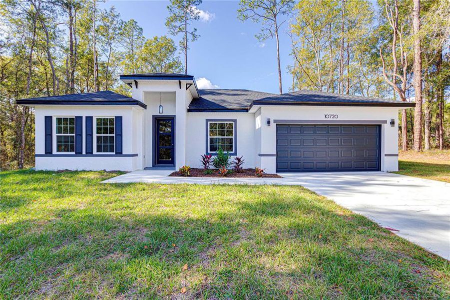Front exterior of a new home in , Citrus Springs, FL, highlighting curb appeal (Image 17).
