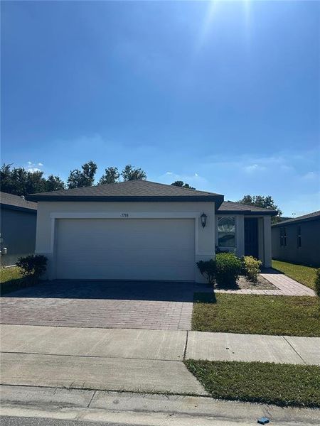 Front exterior of a new home in Villamar - Signature Series, Winter Haven, FL, highlighting curb appeal (Image 1). Front exterior of a new home in Villamar - Signature Series, Winter Haven, FL, highlighting curb appeal (Image 1).