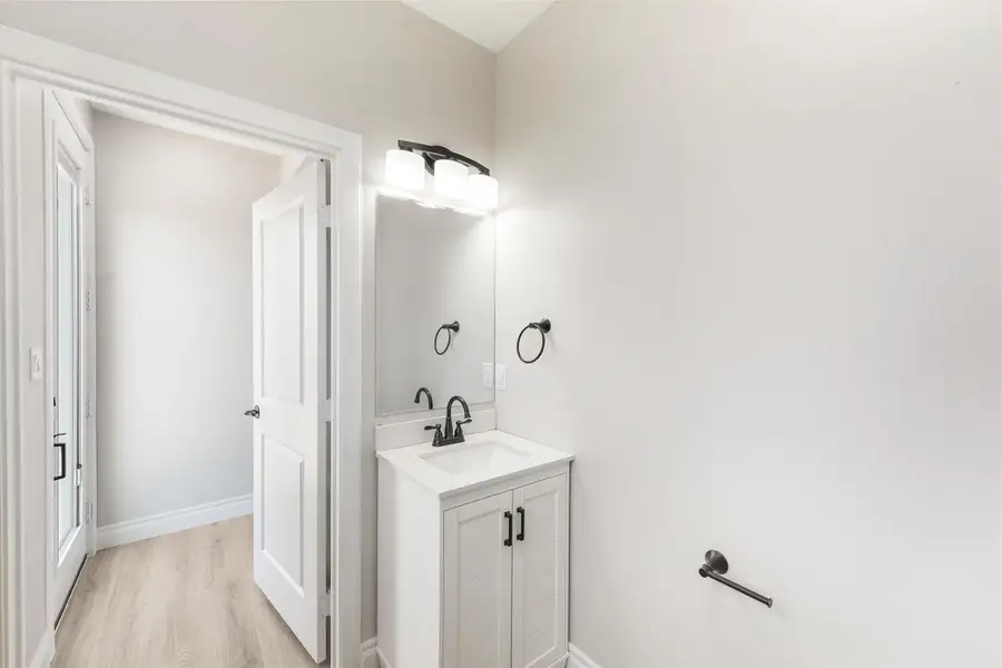 Half Bath / Laundry Room conveniently located by the back door just off the back deck. Half Bath / Laundry Room conveniently located by the back door just off the back deck.