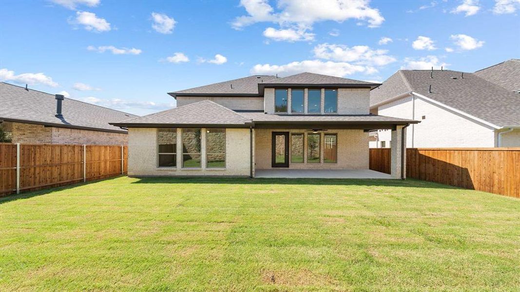Front exterior of a new home in The Heights At Uptown Celina 50', Celina, TX, highlighting curb appeal (Image 2). Front exterior of a new home in The Heights At Uptown Celina 50', Celina, TX, highlighting curb appeal (Image 2).