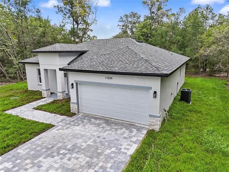 Front exterior of a new home in , Citrus Springs, FL, highlighting curb appeal (Image 1). Front exterior of a new home in , Citrus Springs, FL, highlighting curb appeal (Image 1).