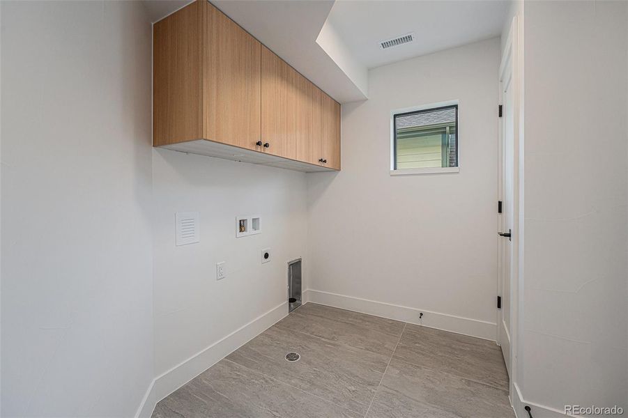 Laundry room attached to the primary suite