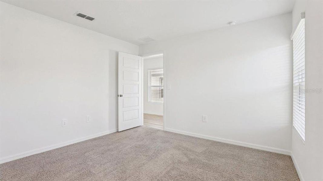 Spacious, unfurnished interior of a new home in Villamar, Winter Haven (Image 18).