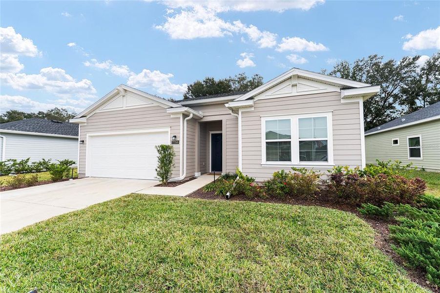 Front exterior of a new home in Liberty Village: Liberty Village - Phase One, Ocala, FL, highlighting curb appeal (Image 29).