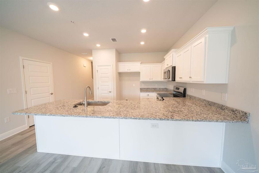 Representative furnished interior of a home built from the Plan 1542 Townhome by Adams Homes in Lexlee Estates, Pensacola (Image 5). Representative furnished interior of a home built from the Plan 1542 Townhome by Adams Homes in Lexlee Estates, Pensacola (Image 5).